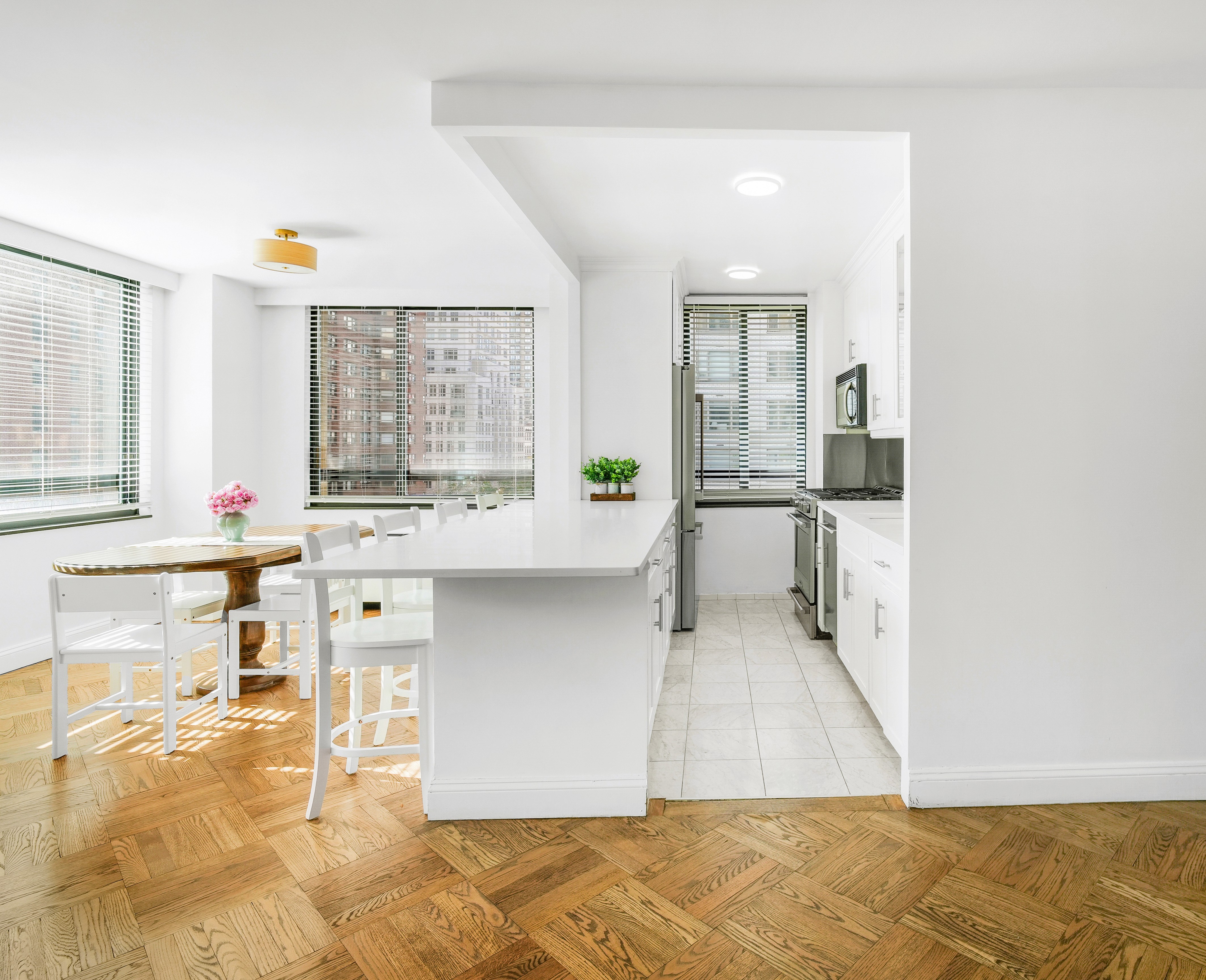 171 East 84th Street, Unit 4B Manhattan, NY 10028 - Photo 5 of 20 a living room with granite countertop furniture and a fireplace