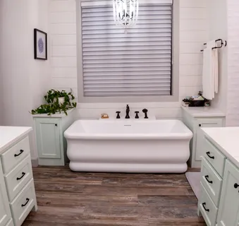 a spacious bathroom with a bathtub and sink