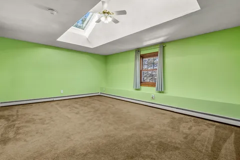 a view of a room with a window and a projector