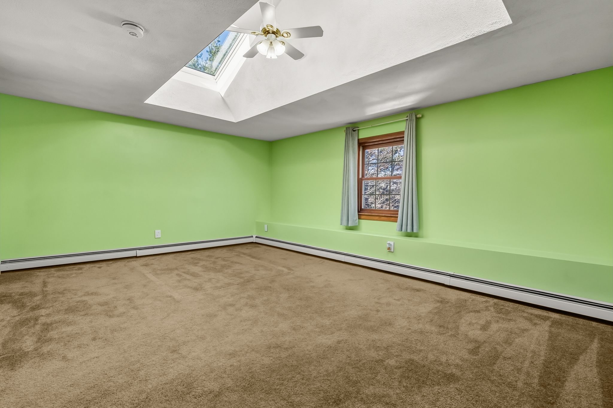 129 H J Albee Drive Braintree, MA 02184 - Photo 19 of 36 a view of a room with a window and a projector