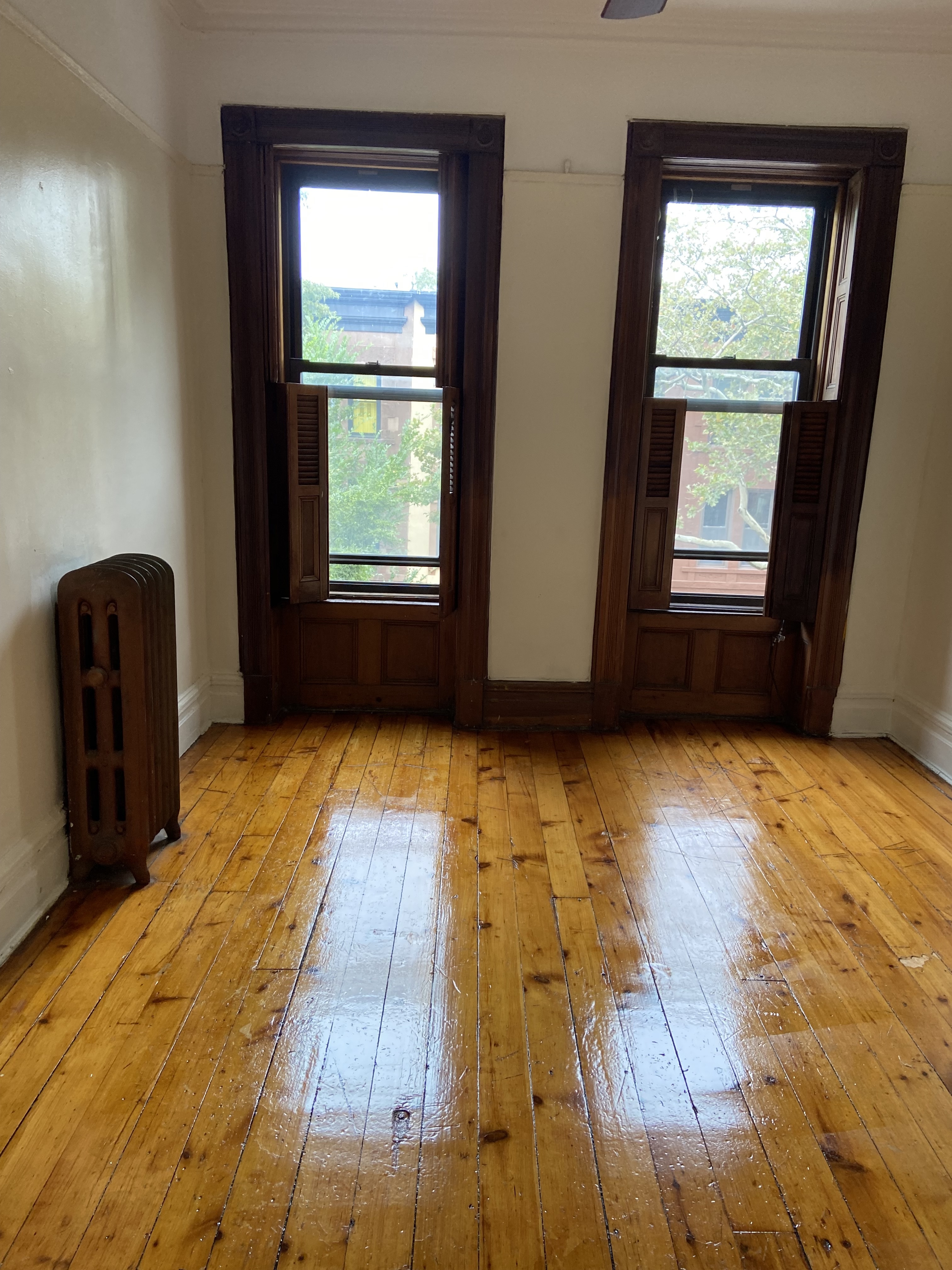 452 MacDonough Street, Unit 3 Brooklyn, NY 11233 - Photo 4 of 7 a view of an empty room with a window