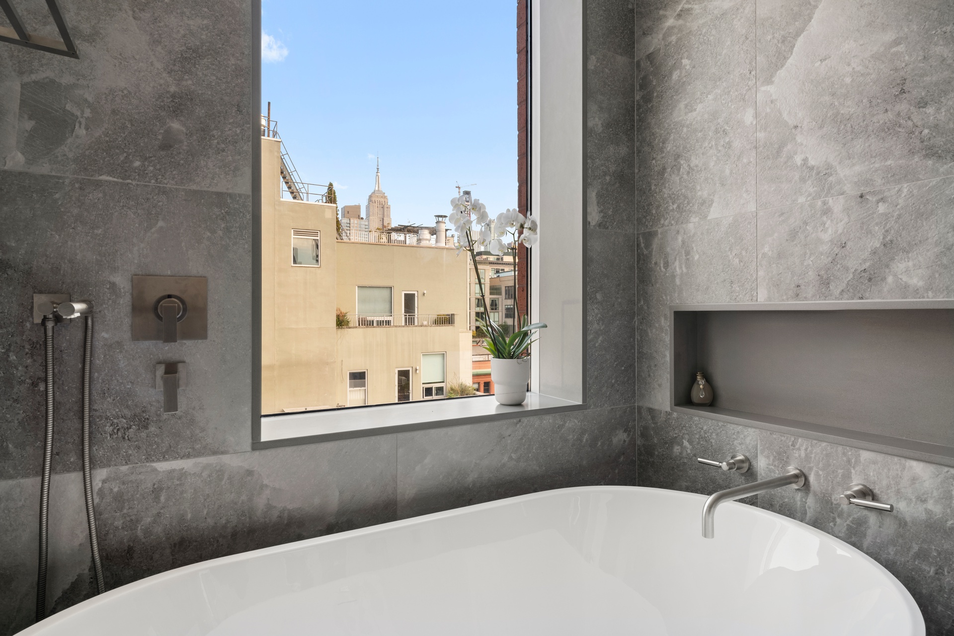 151 West 17th Street, Unit PHF Manhattan, NY 10011 - Photo 10 of 19 a bathroom with a bathtub and shower