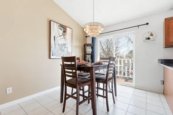 a kitchen with stainless steel appliances granite countertop a stove microwave and sink