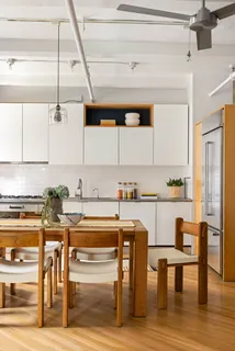 a kitchen with stainless steel appliances granite countertop a sink and cabinets