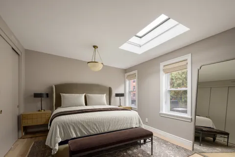 a room with furniture and a book shelf