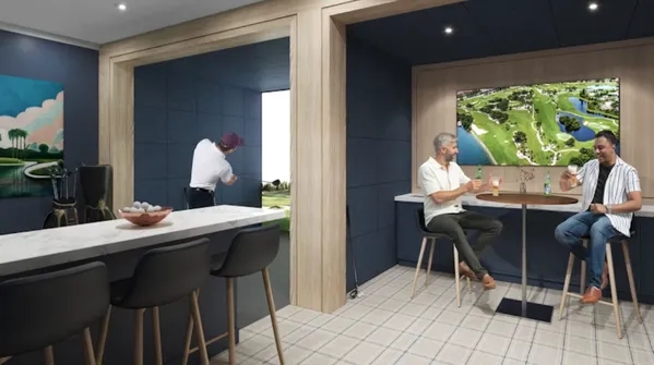 a view of a dining room with a table and chairs