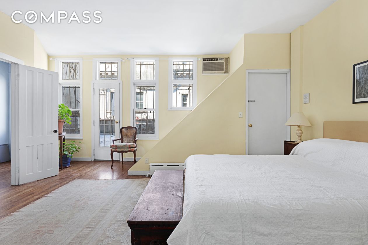 6 Centre Market Place, Unit 3 Manhattan, NY 10013 - Photo 4 of 9 a bedroom with a bed and a table