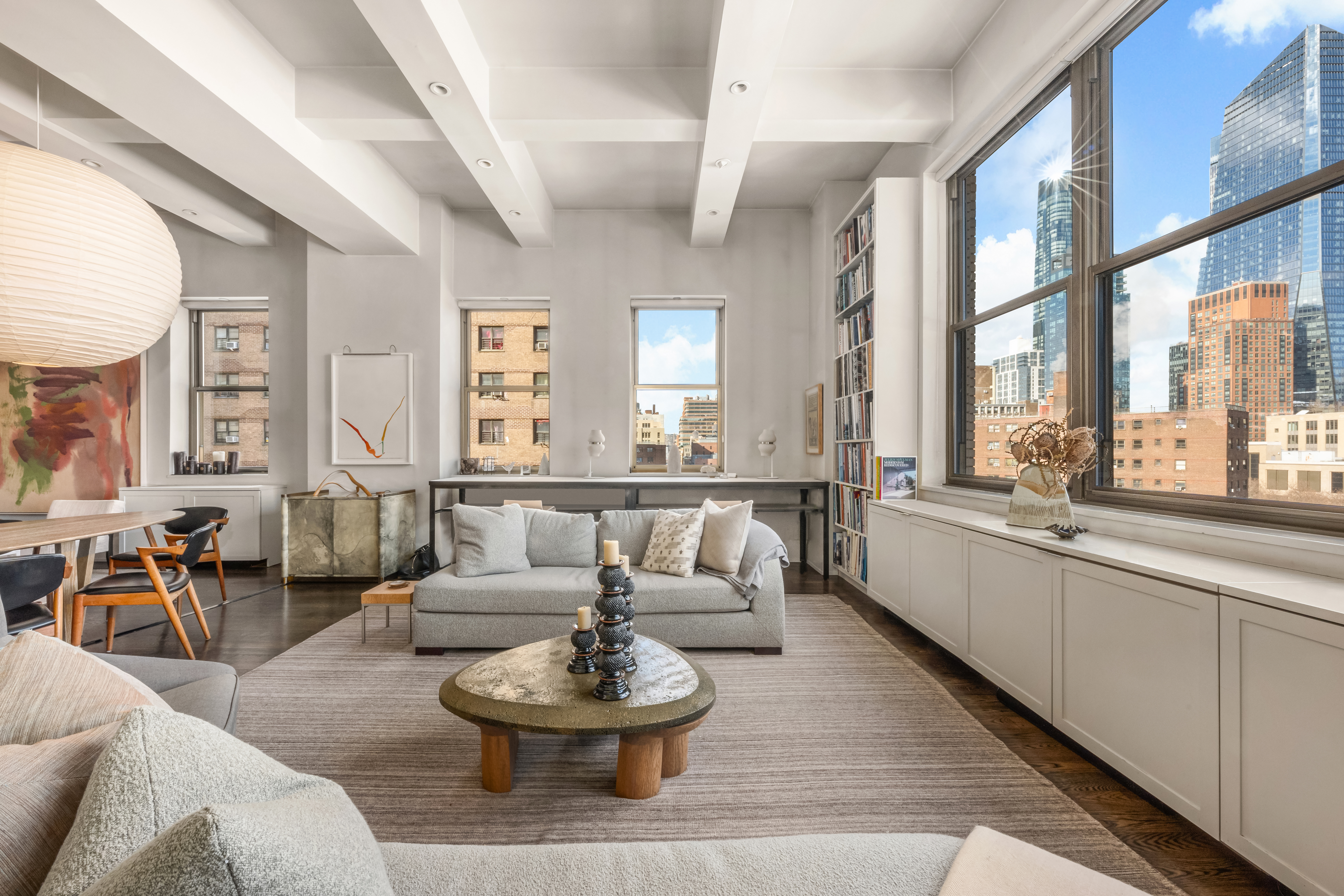 263 9th Avenue, Unit 7E Manhattan, NY 10001 - Photo 2 of 17 a living room with furniture and a large window