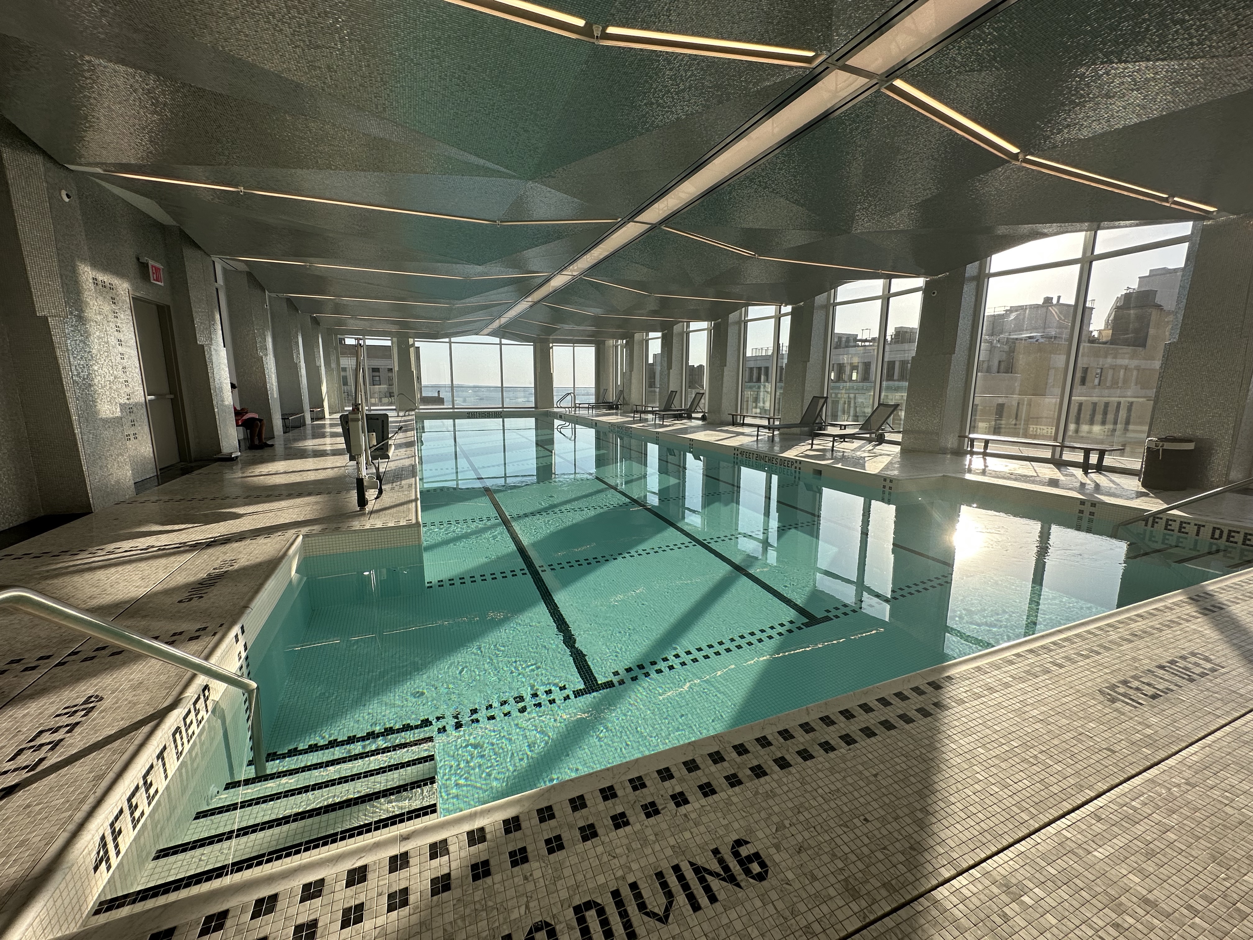 1 Wall Street, Unit 915 Manhattan, NY 10005 - Photo 10 of 18 a sitting area with chairs and a table