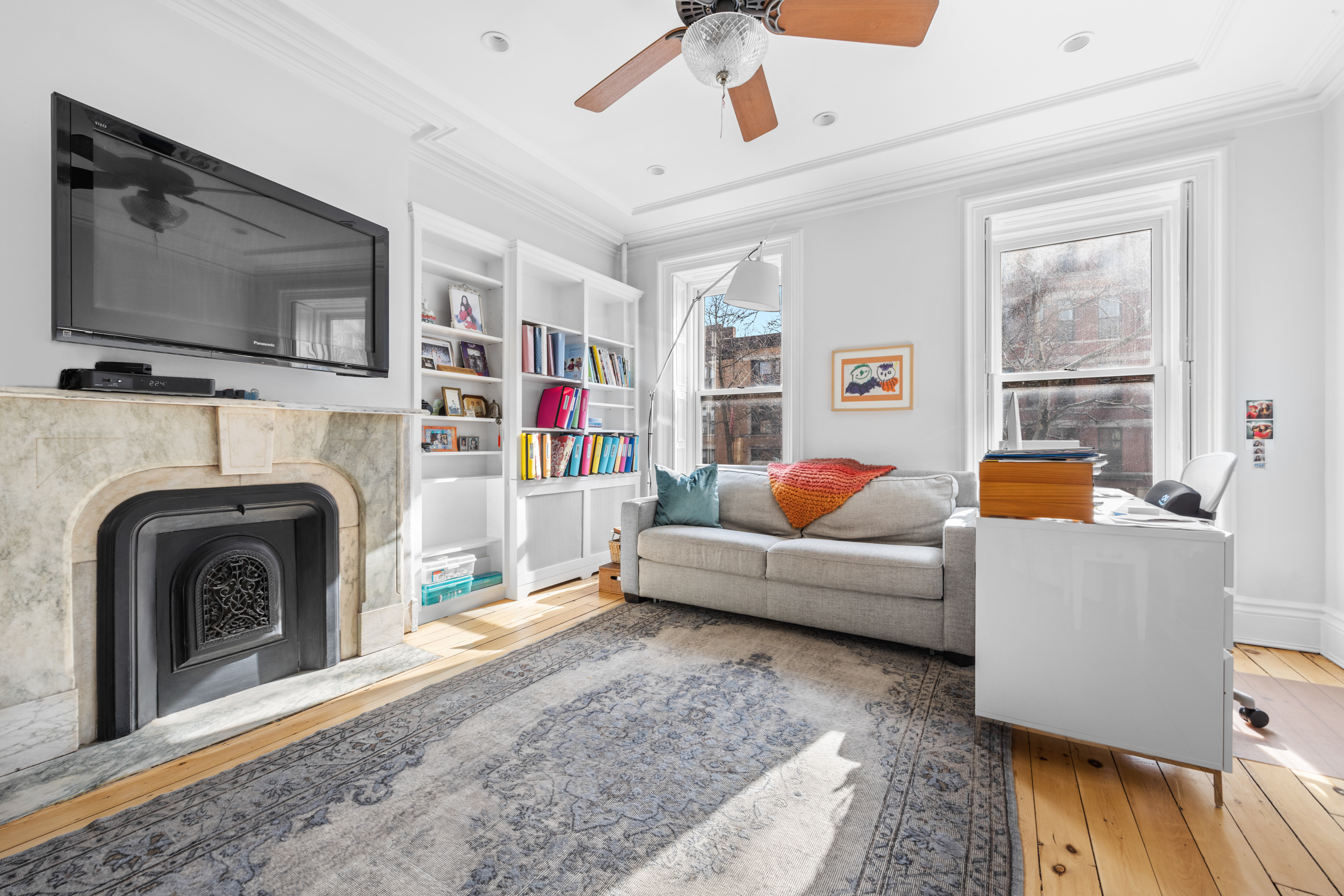 387 Union Street, Unit 2 Brooklyn, NY 11231 - Photo 7 of 12 a living room with furniture and a flat screen tv