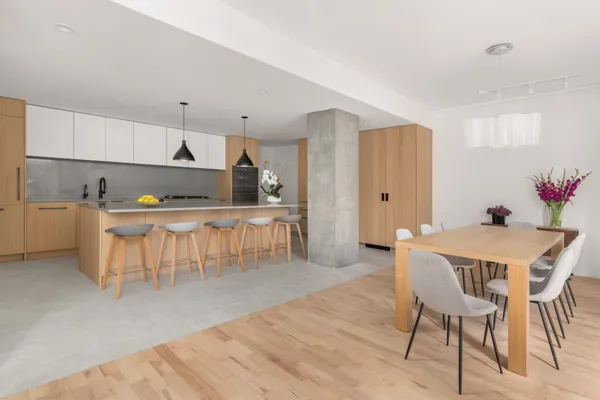 a view of a dining room with furniture and wooden floor
