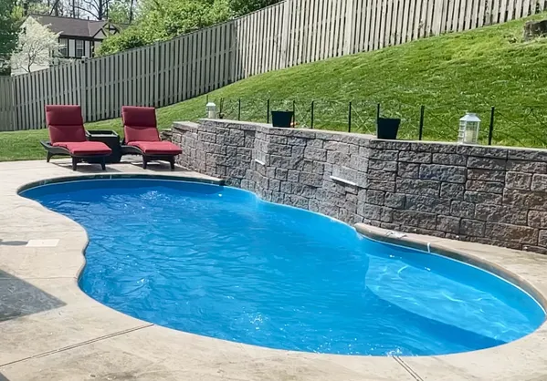 a view of a swimming pool with a patio