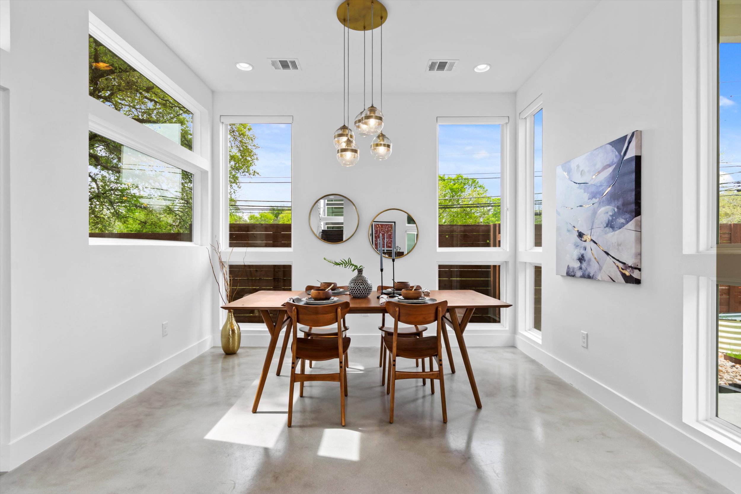513 West Croslin Street, Unit A Austin, TX 78752 - Photo 6 of 39 a view of a dining room with furniture window and wooden floor