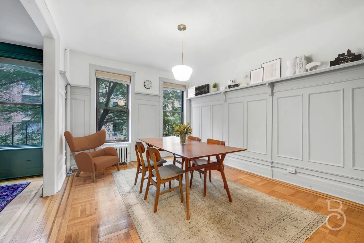 a view of a dining room with furniture window and wooden floor