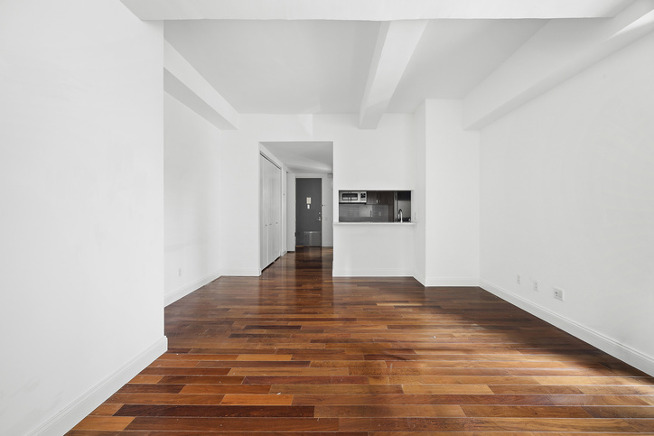 88 Greenwich Street, Unit 1025 Manhattan, NY 10006 - Photo 2 of 14 a view of empty room with wooden floor