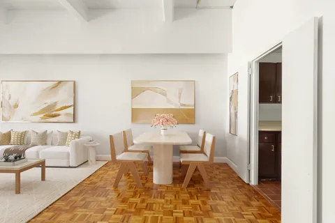 a living room with furniture and a rug