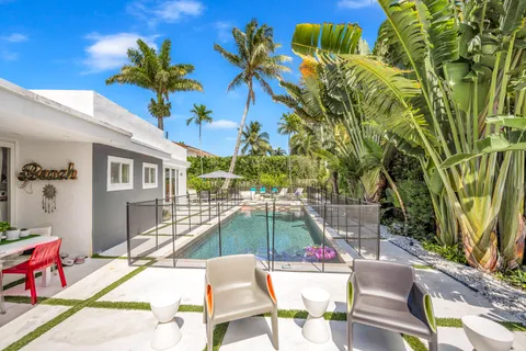 a view of a swimming pool with a patio