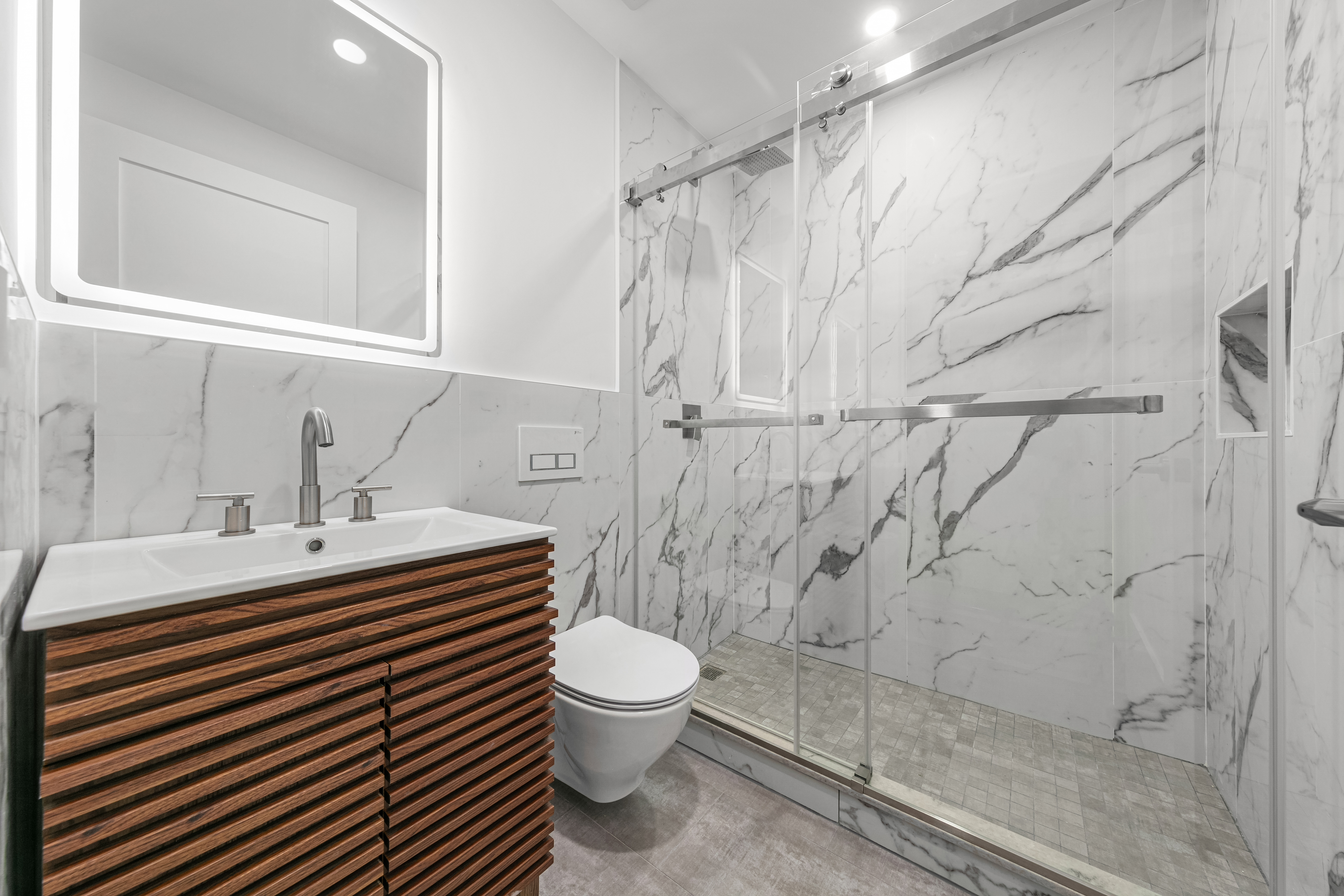 177 East 3rd Street, Unit 2A Manhattan, NY 10009 - Photo 7 of 8 a bathroom with a sink toilet and shower