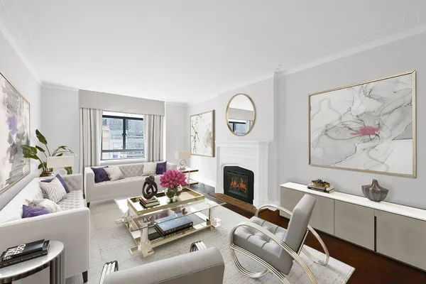 a living room with furniture a fireplace and a painting on the wall