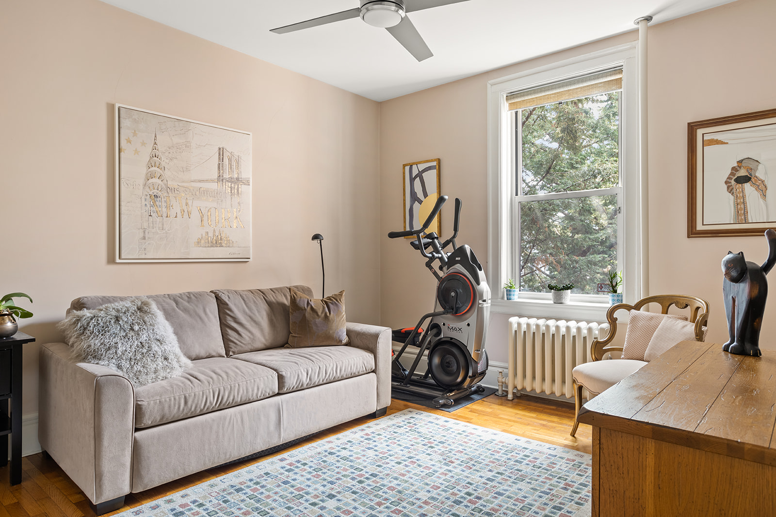 35-56 79th Street, Unit 22 Queens, NY 11372 - Photo 8 of 14 a living room with furniture and a window