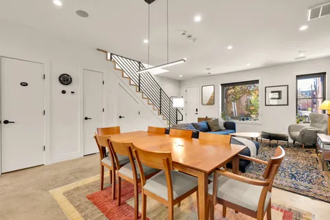 a dining room with furniture and window