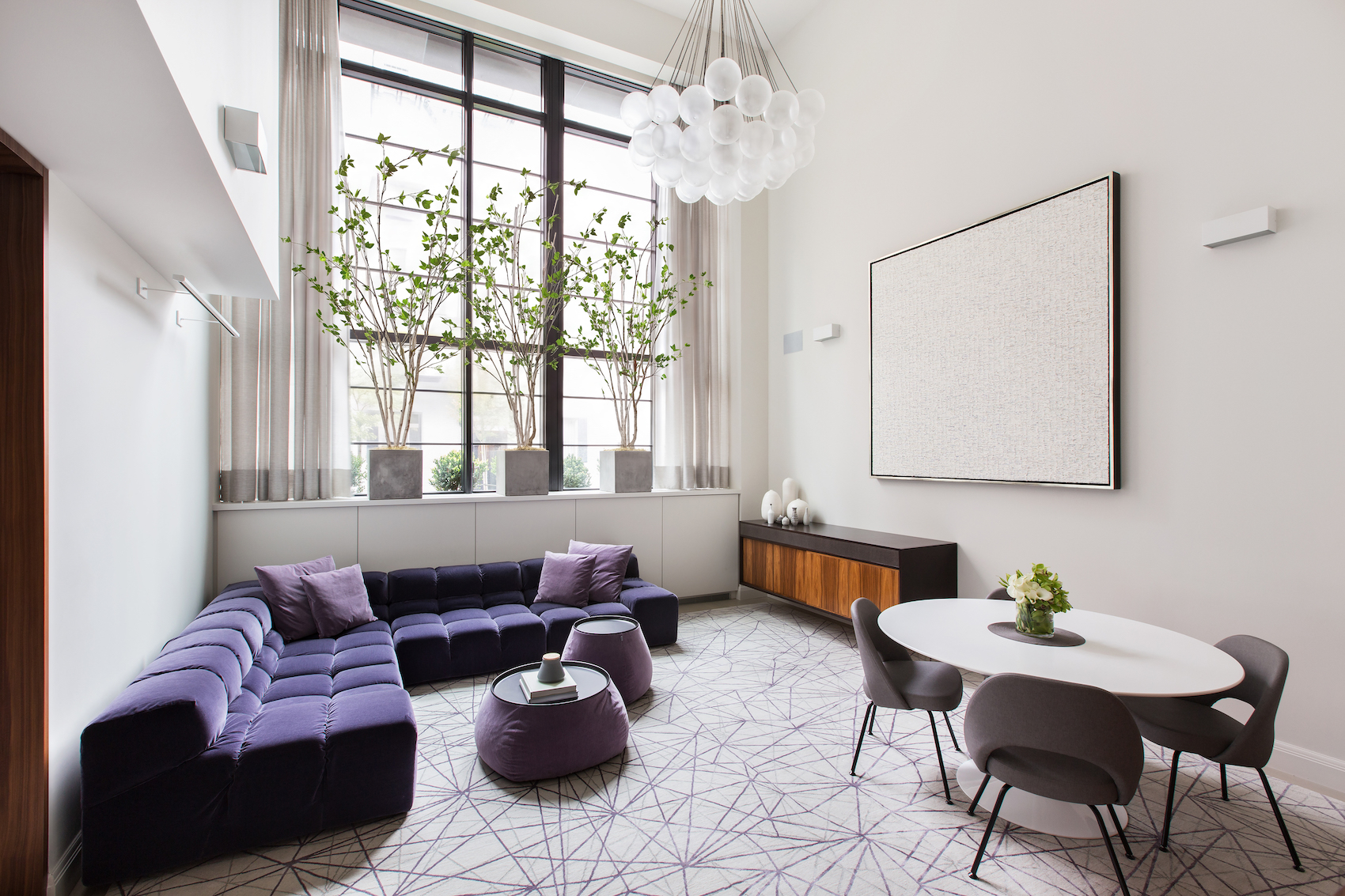 150 Charles Street, Unit M10 Manhattan, NY 10014 - Photo 7 of 34 a living room with furniture and a large window