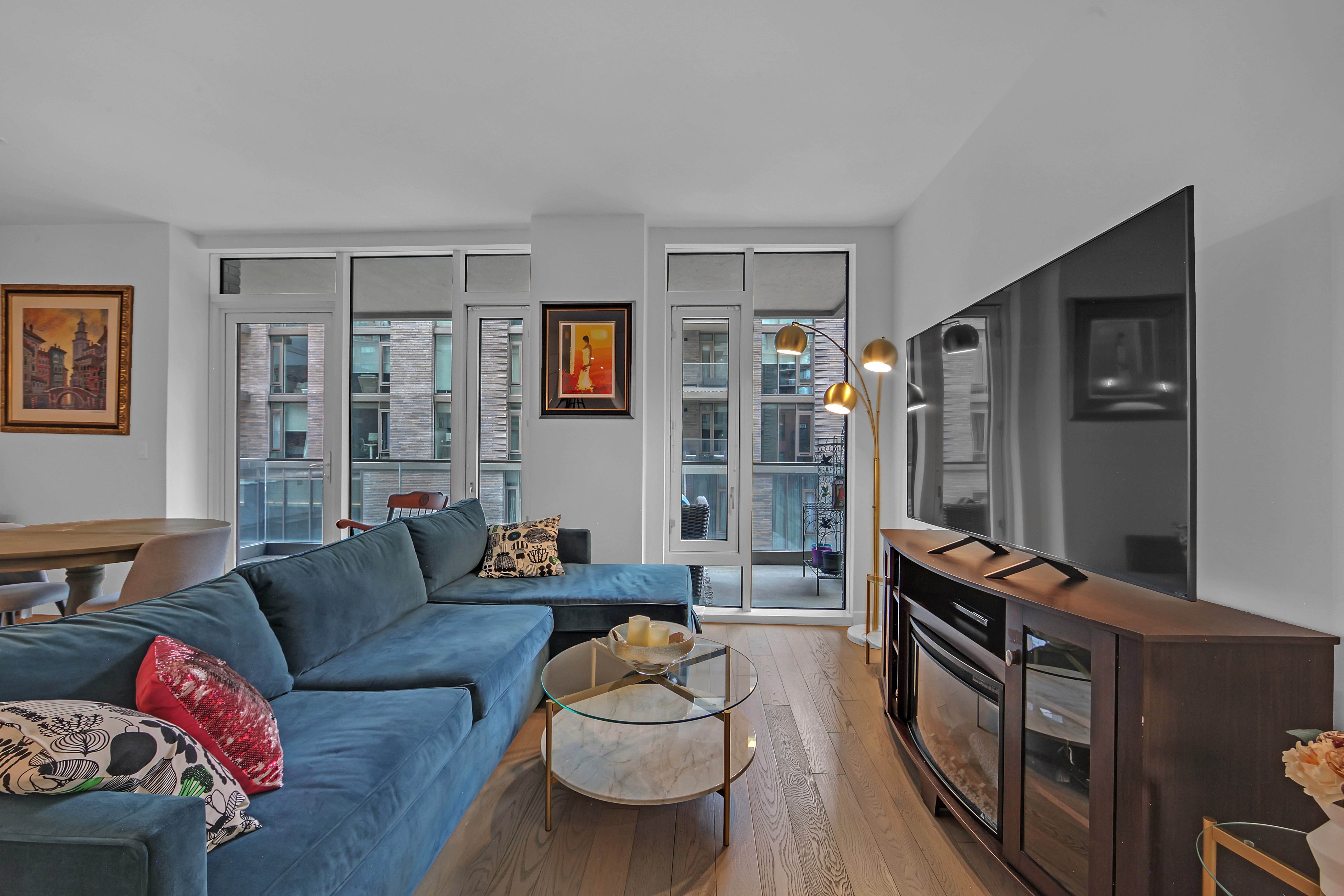 505-513 West 43rd Street, Unit 3M Manhattan, NY 10036 - Photo 3 of 20 a living room with furniture fireplace and a window