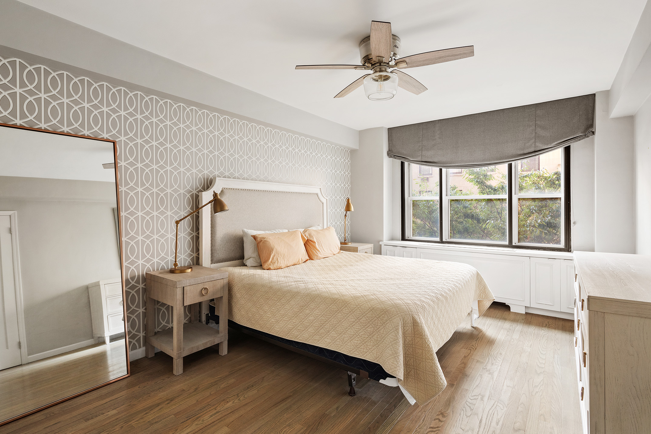 11 5th Avenue, Unit 3E Manhattan, NY 10003 - Photo 4 of 6 a bedroom with a large bed and a large window