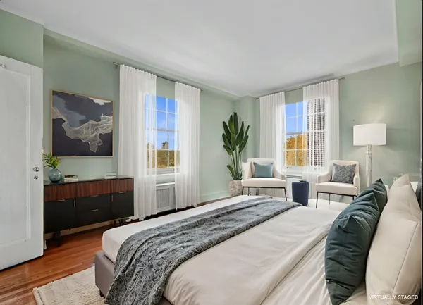 a bedroom with a bed and a dresser
