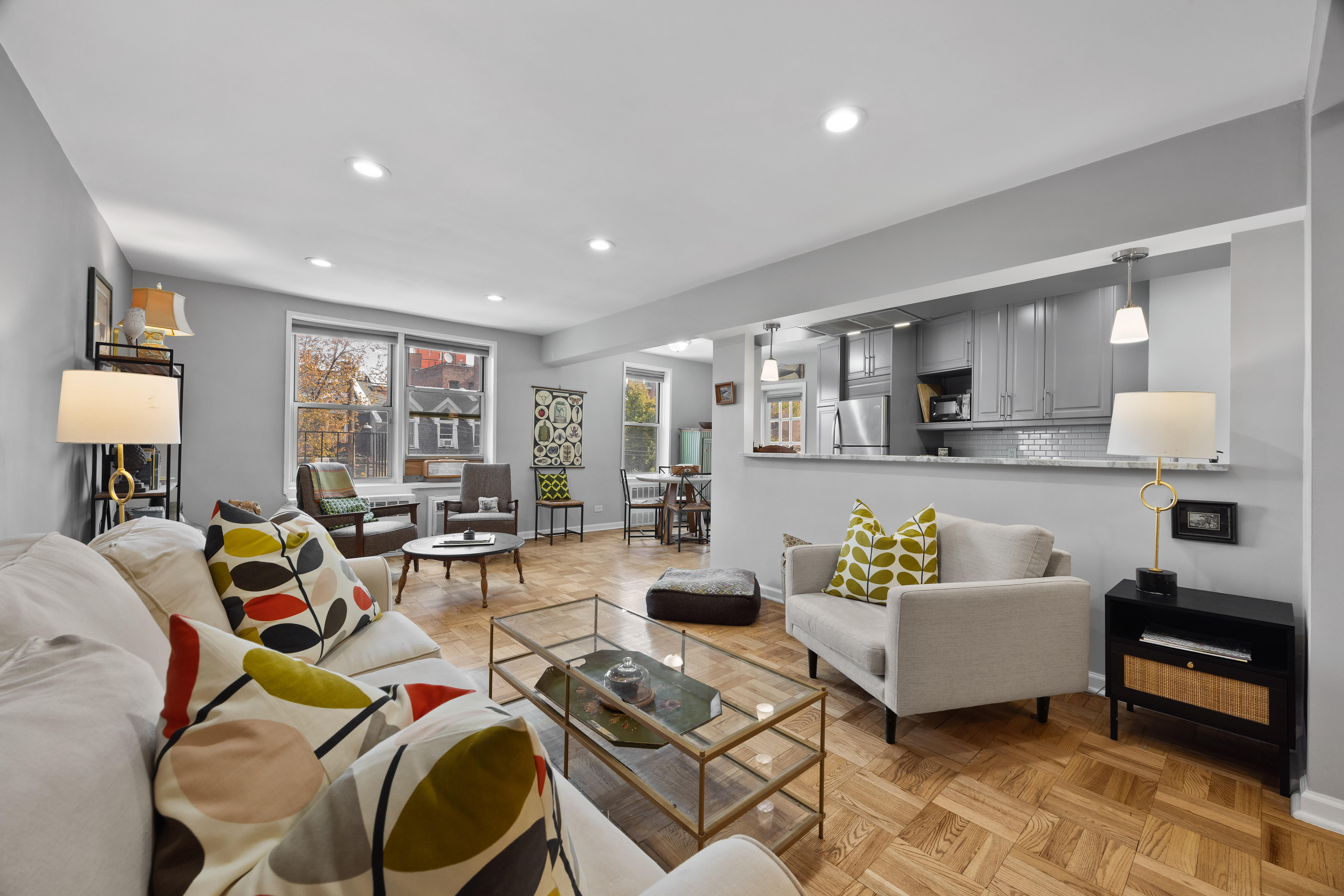 255 Fieldston Terrace, Unit 2L Bronx, NY 10471 - Photo 2 of 32 a living room with furniture and kitchen view