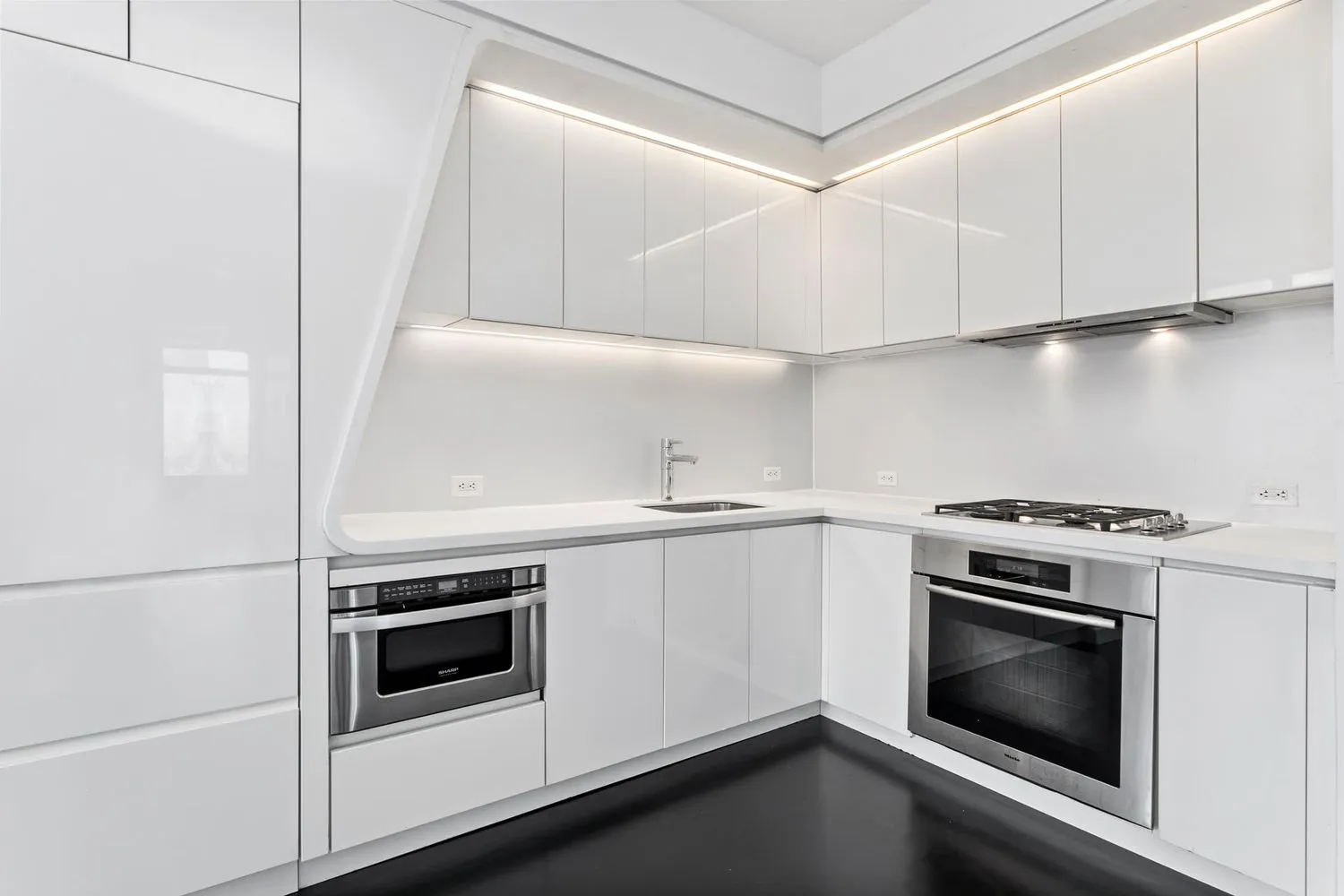 a white stove top oven sitting inside of a kitchen