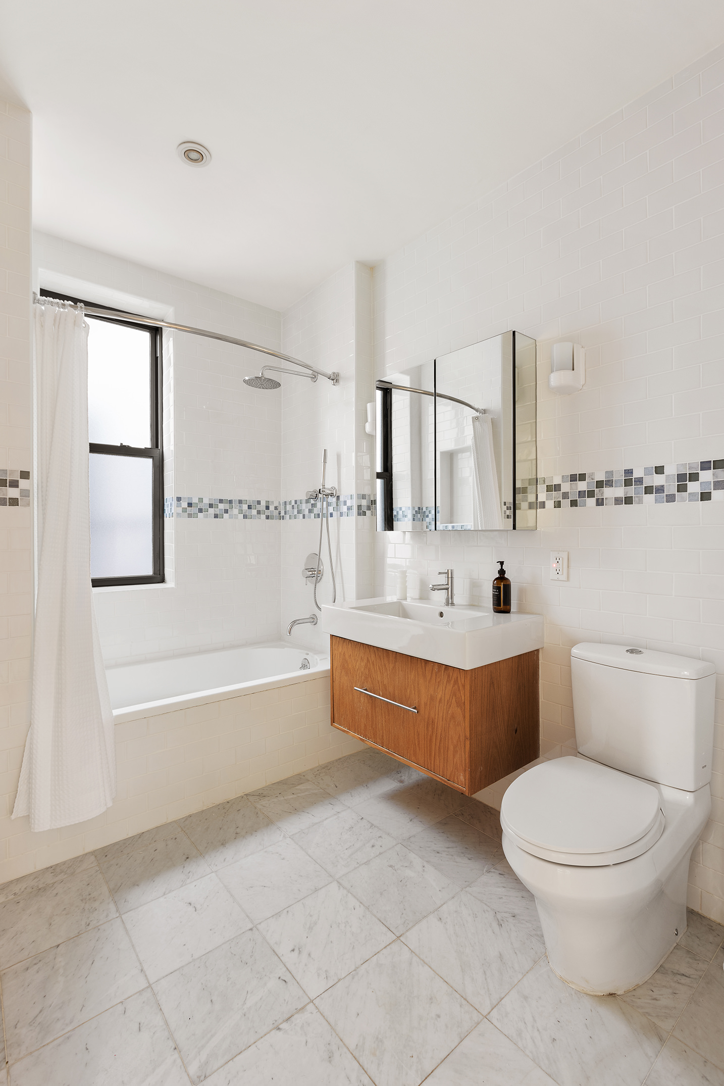 1845 Adam Clayton Powell Jr Boulevard, Unit 5C Manhattan, NY 10026 - Photo 15 of 17 a bathroom with a bathtub toilet and sink