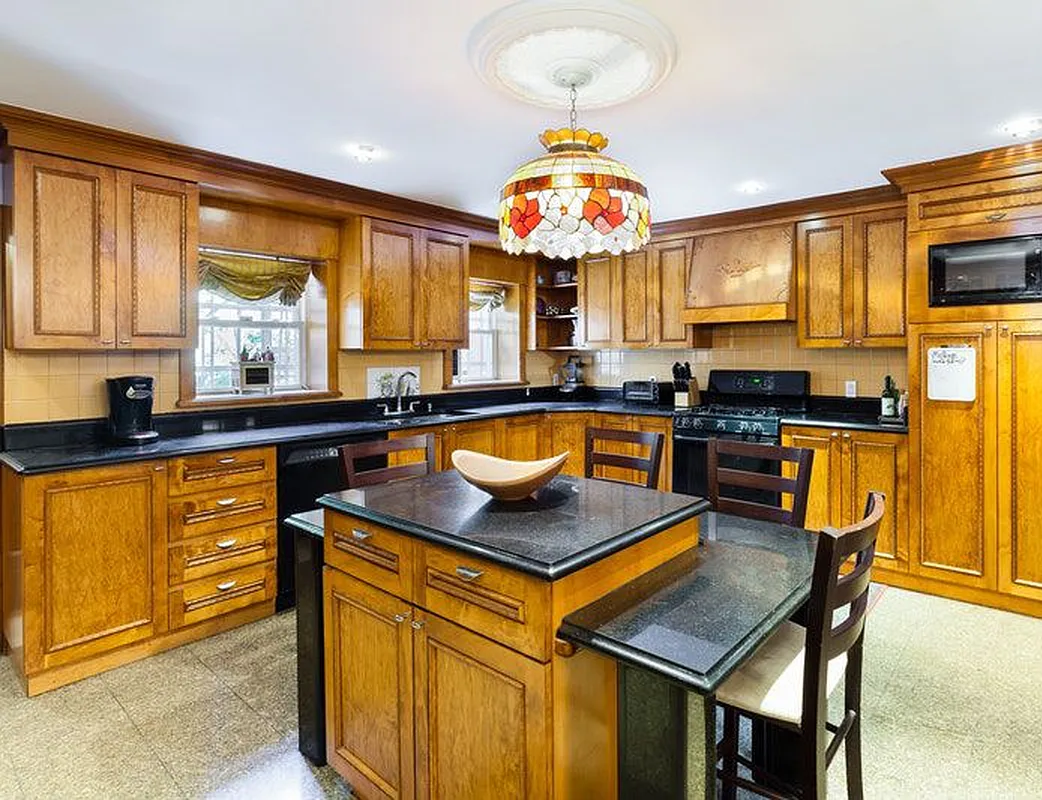 688 Saint Marks Avenue, Unit 1 Brooklyn, NY 11216 - Photo 4 of 10 a kitchen with a table and chairs in it