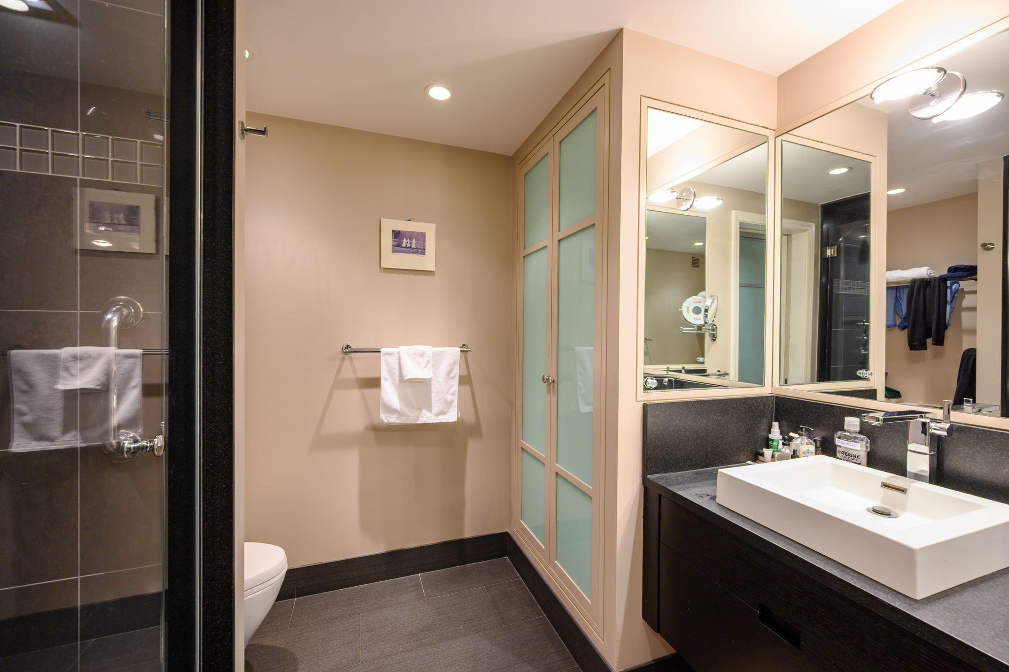65 East India Row, Unit 38 F/G Boston, MA 02110 - Photo 19 of 32 a en suite bathroom with a sink a mirror and a shower