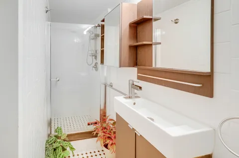 a bathroom with a sink and a mirror