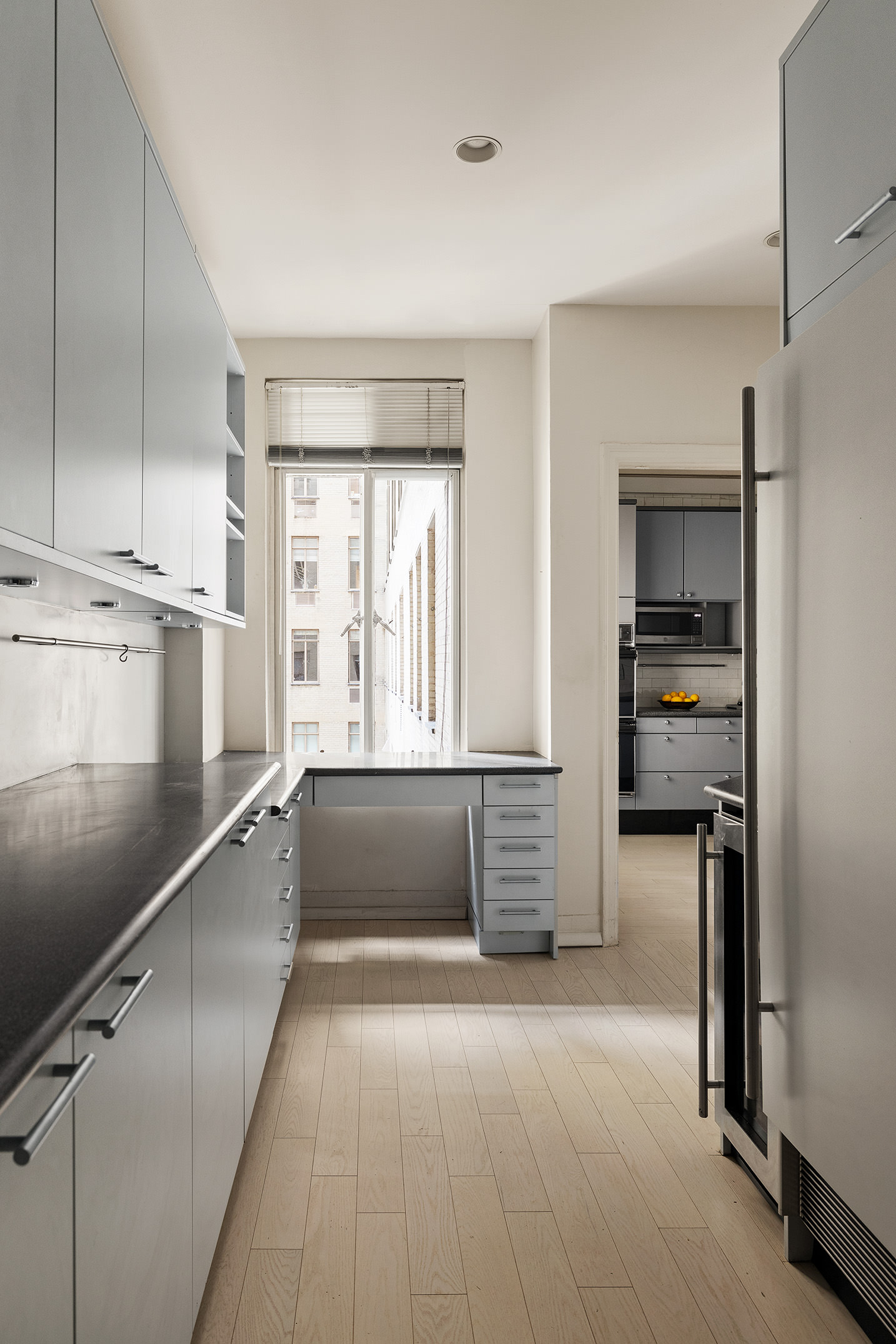 145-146 Central Park West, Unit 8C Manhattan, NY 10023 - Photo 11 of 17 a kitchen with a refrigerator and a sink