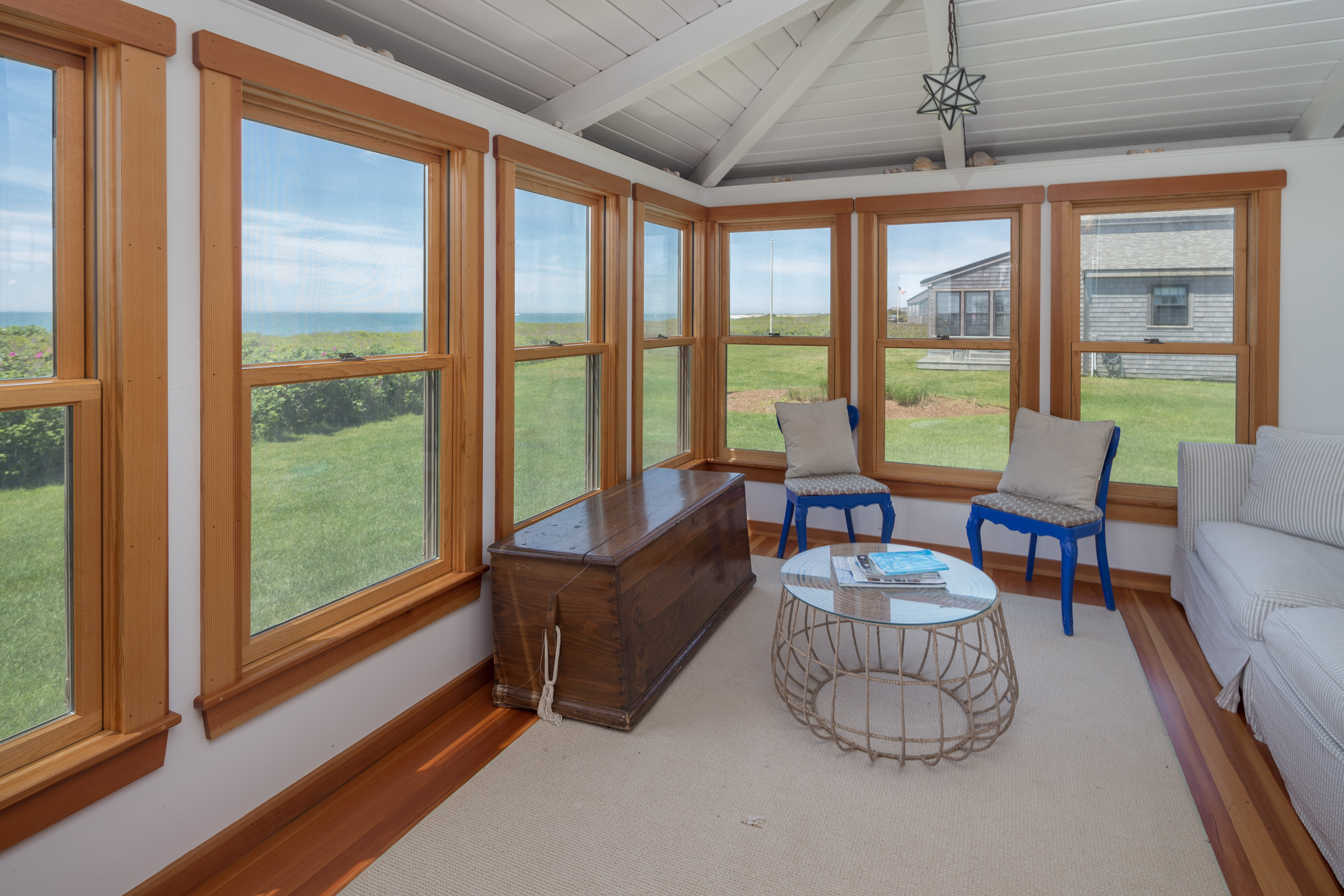 65 Nobadeer Avenue Nantucket, MA 02554 - Photo 10 of 20 a living room with furniture and floor to ceiling windows