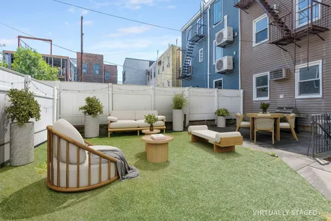 a view of a patio with couple of chairs