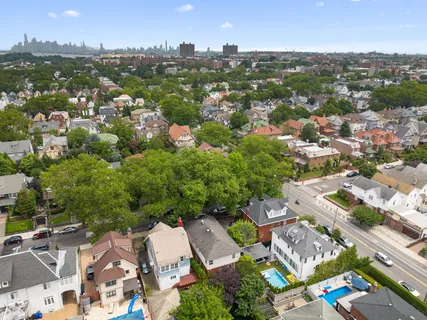 an aerial view of a house with a yard