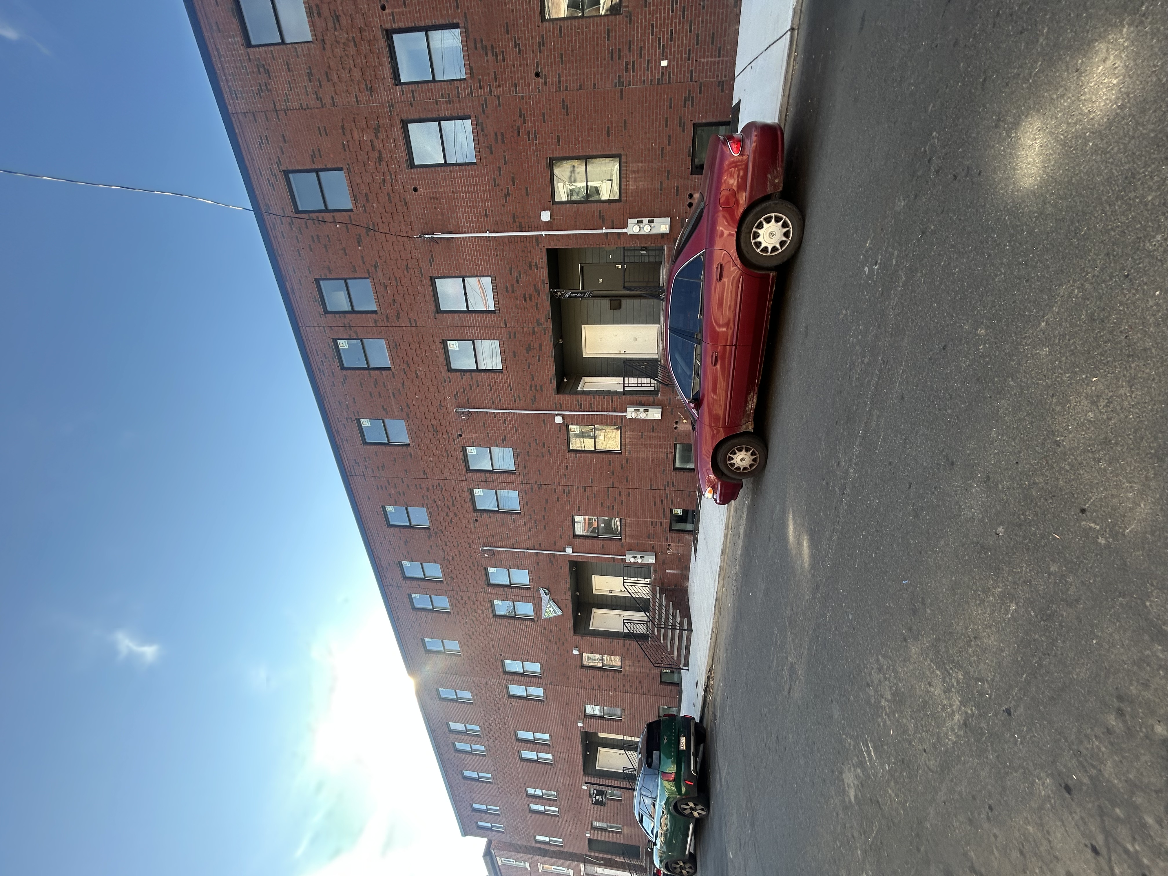 a front view of a building with parking space