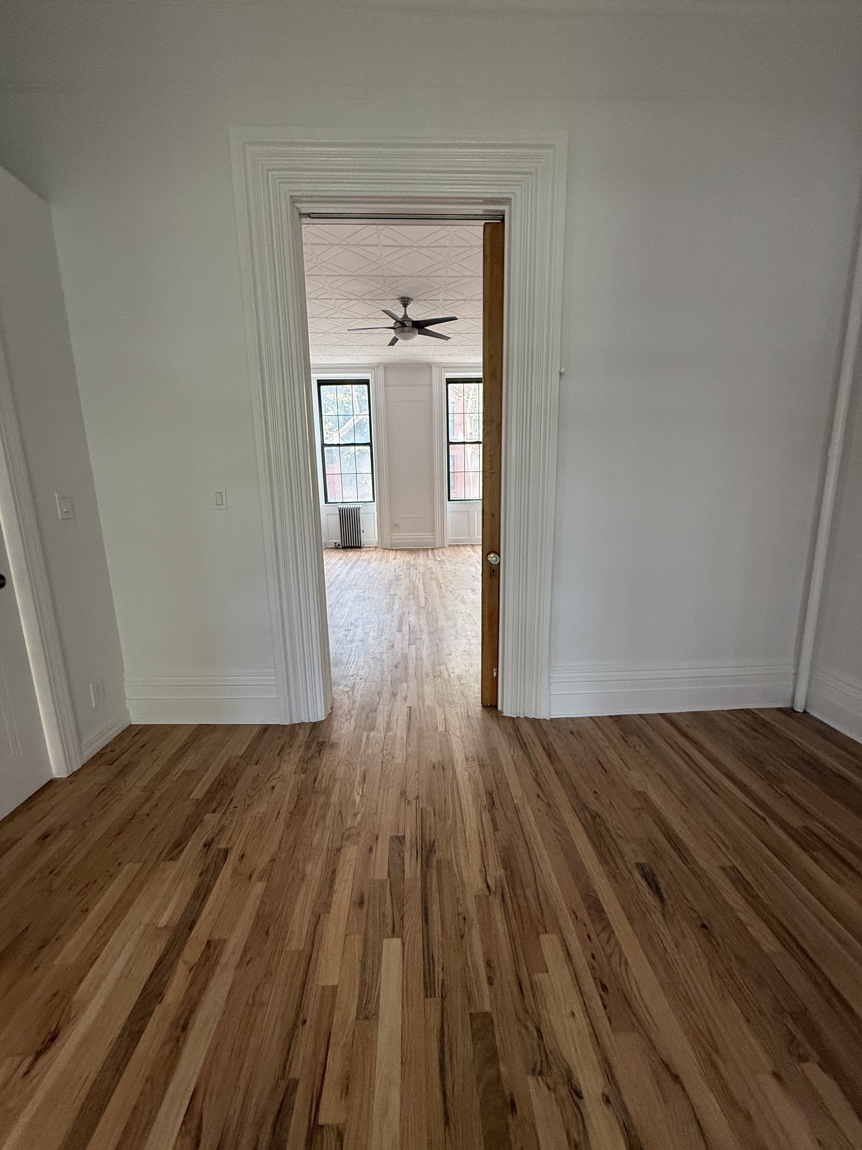 141 Summit Street, Unit 2 Brooklyn, NY 11231 - Photo 6 of 12 a view of a room with wooden floor and a sink