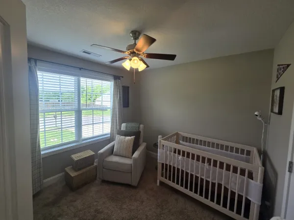 a bedroom with furniture and a window