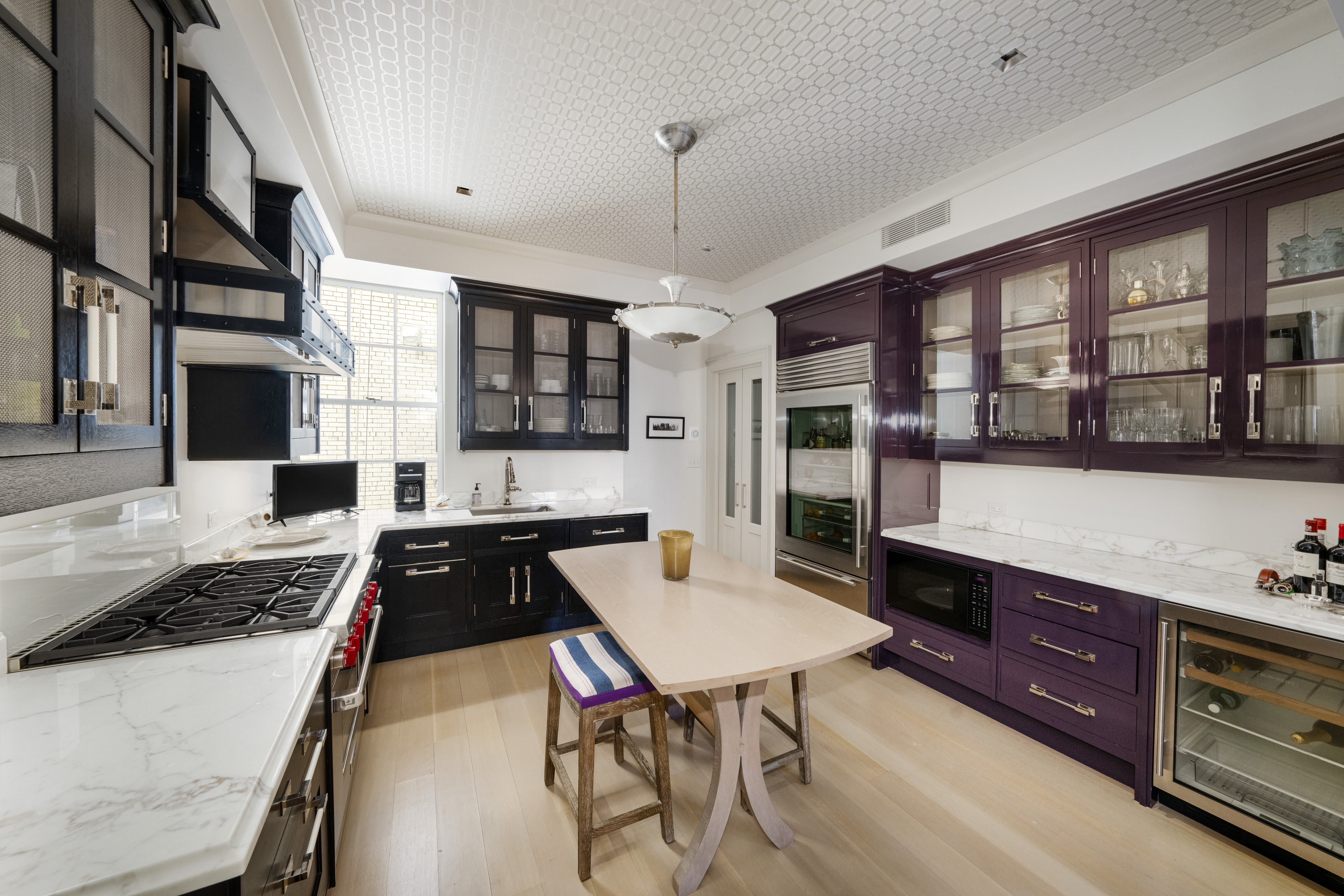 850 Park Avenue, Unit 9C Manhattan, NY 10075 - Photo 5 of 14 a kitchen with stainless steel appliances granite countertop a stove refrigerator and cabinets