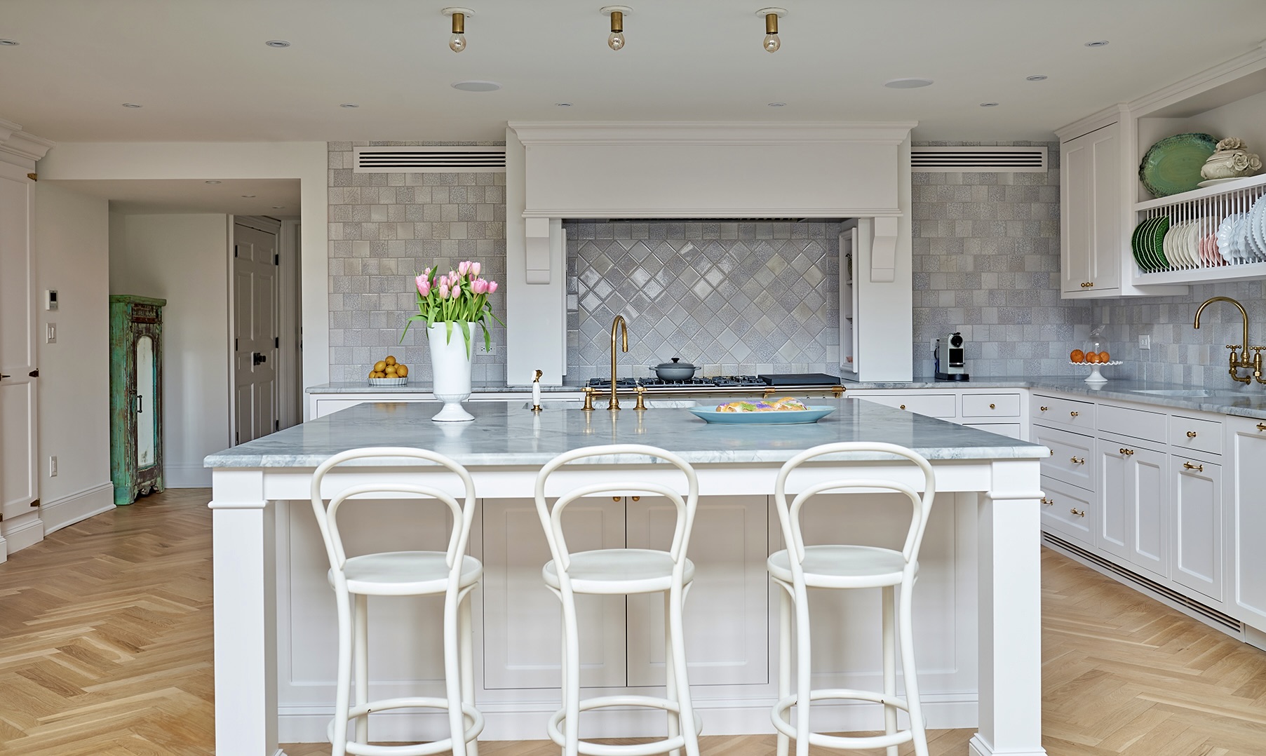 435 Clinton Avenue Brooklyn, NY 11238 - Photo 7 of 27 a white kitchen with a dining table and chairs