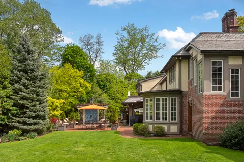 a front view of a house with garden