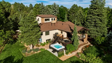 a kitchen with stainless steel appliances kitchen island granite countertop a refrigerator and a stove top oven