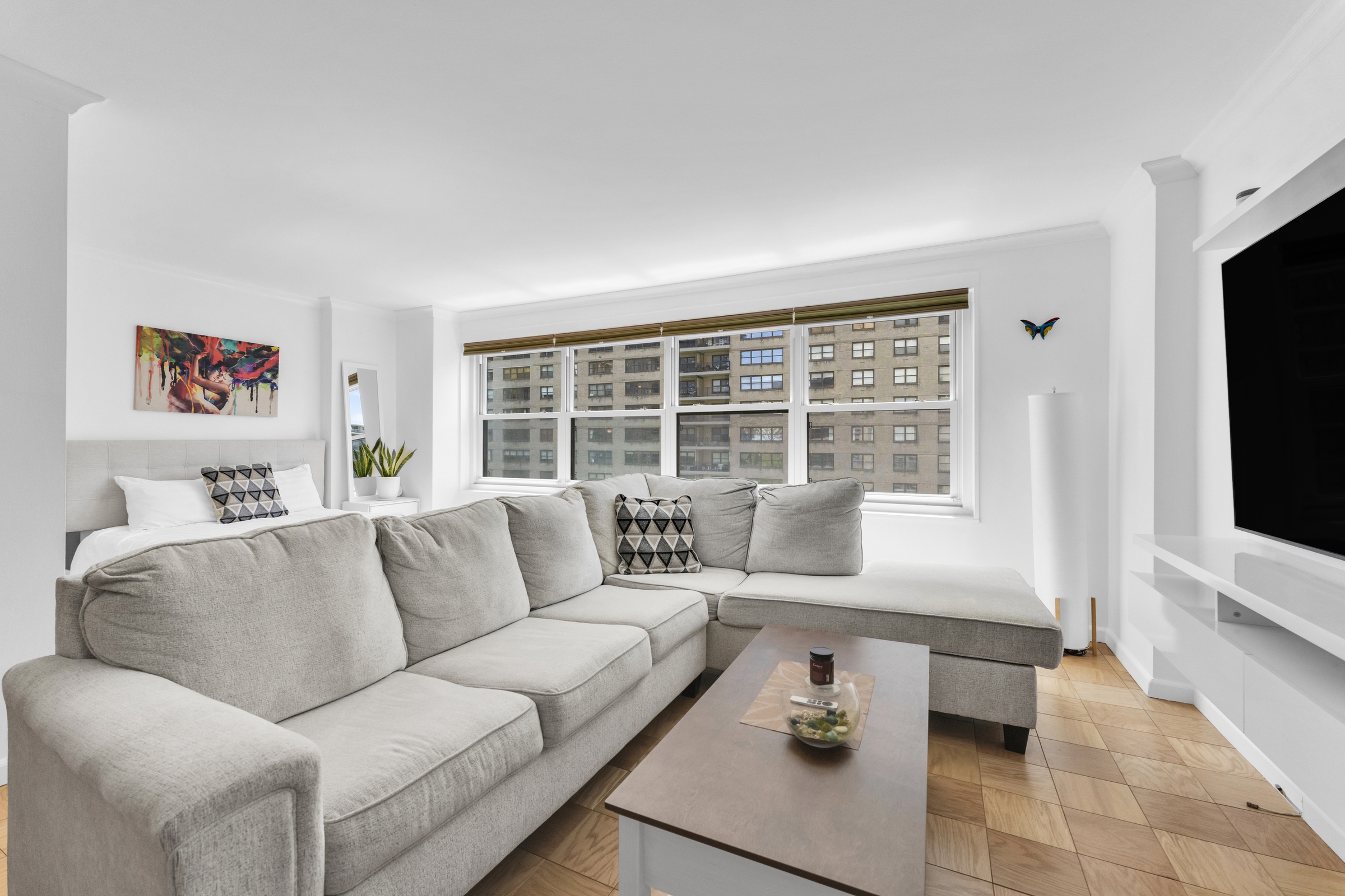 150 West End Avenue, Unit 10P Manhattan, NY 10023 - Photo 1 of 17 a living room with furniture and a flat screen tv