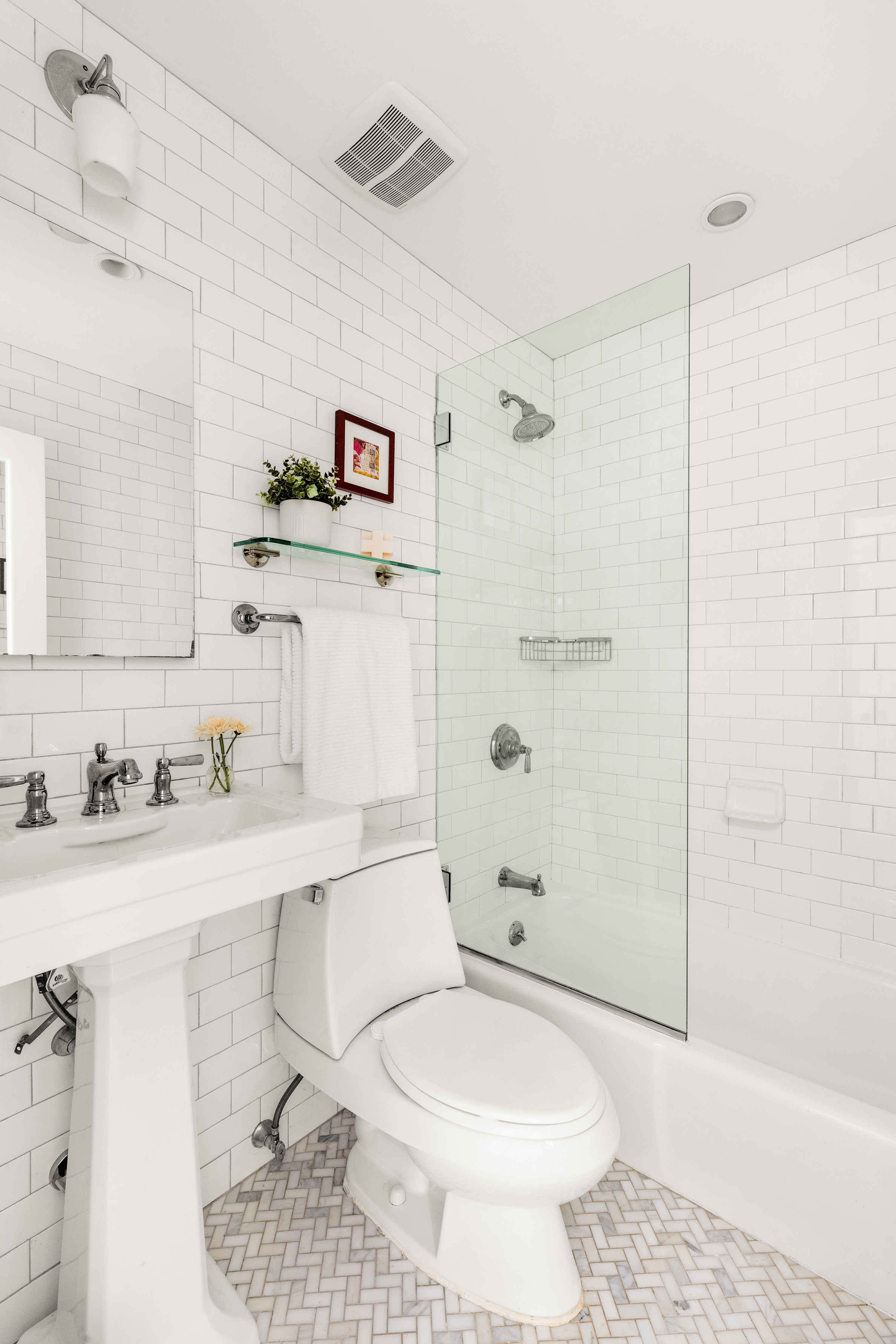 315 3rd Street, Unit 2A Brooklyn, NY 11215 - Photo 4 of 8 a bathroom with a sink toilet vanity and shower