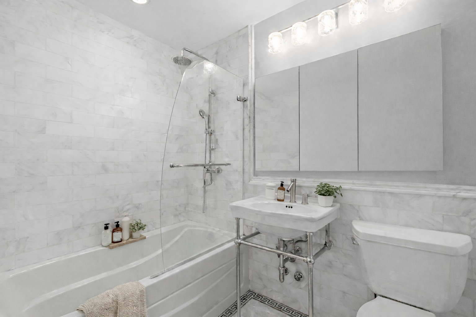 1485 5th Avenue, Unit 12G Manhattan, NY 10035 - Photo 8 of 14 a bathroom with a sink a toilet and bathtub
