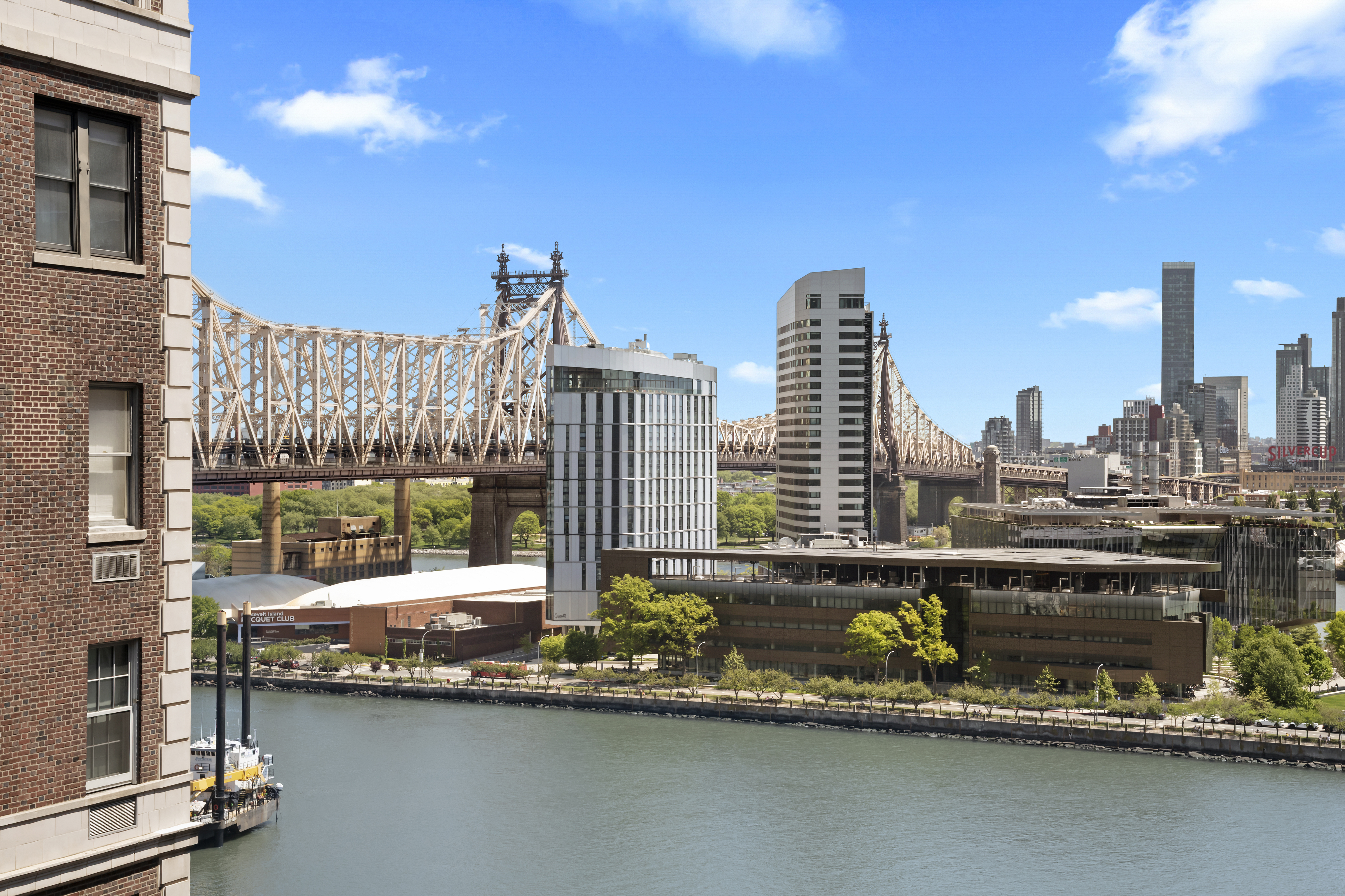 25 Sutton Place South, Unit 16B Manhattan, NY 10022 - Photo 2 of 16 a view of a city with tall buildings